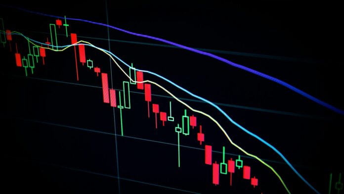 A stock market candlestick chart displayed on a dark screen
