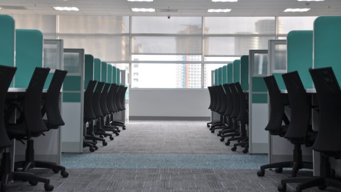 office-wide Empty office chairs at cubicles