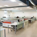 The Open Office Was Built on a Measurement. Then Nobody Measured It Again for Sixty Years. An open plan office with long rows of white desks