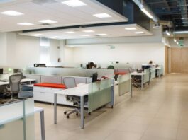 The Open Office Was Built on a Measurement. Then Nobody Measured It Again for Sixty Years. An open plan office with long rows of white desks